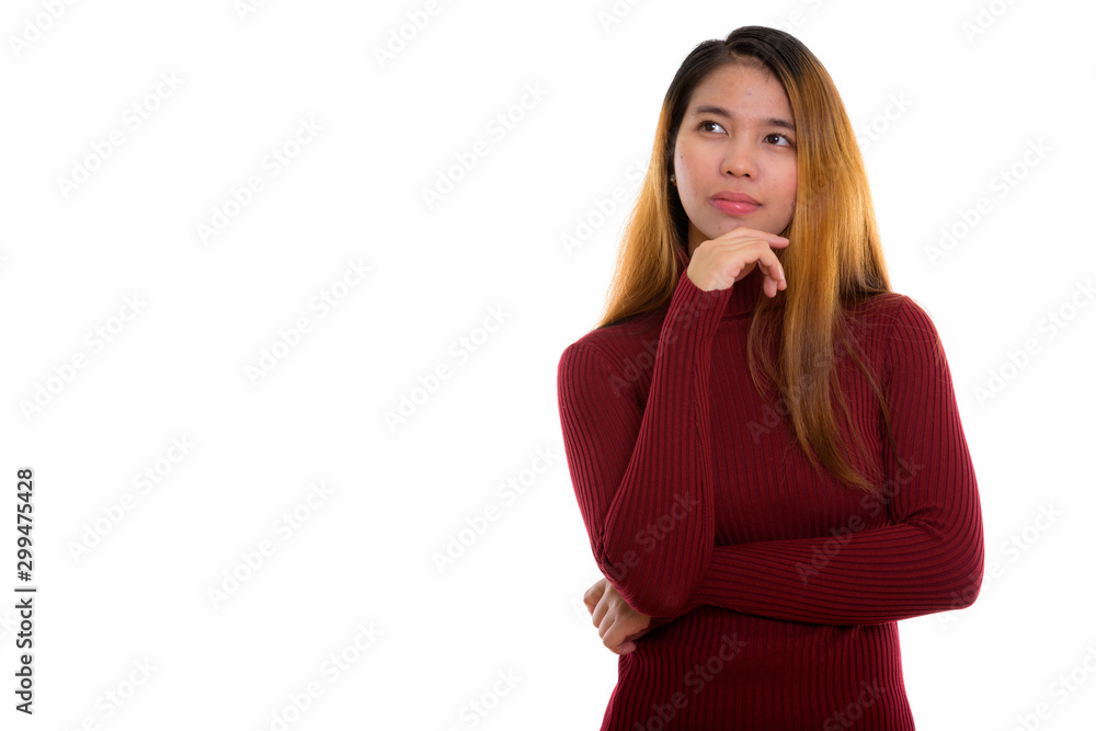 Studio shot of young Asian woman with turtleneck sweater Studio shot of young Asian woman with turtleneck sweater