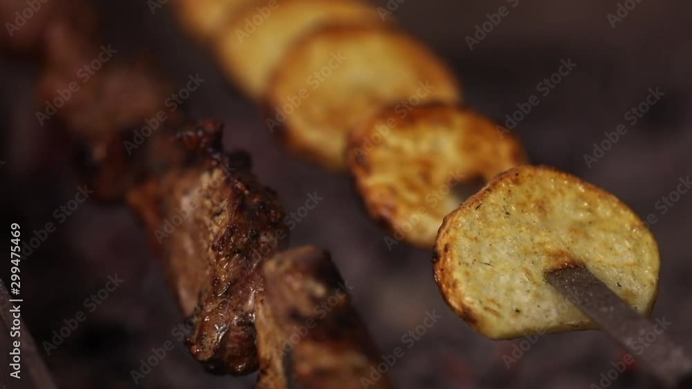 Barbecue and Potato on skewer. Slow Motion Barbecue and Potato on skewer. Slow Motion