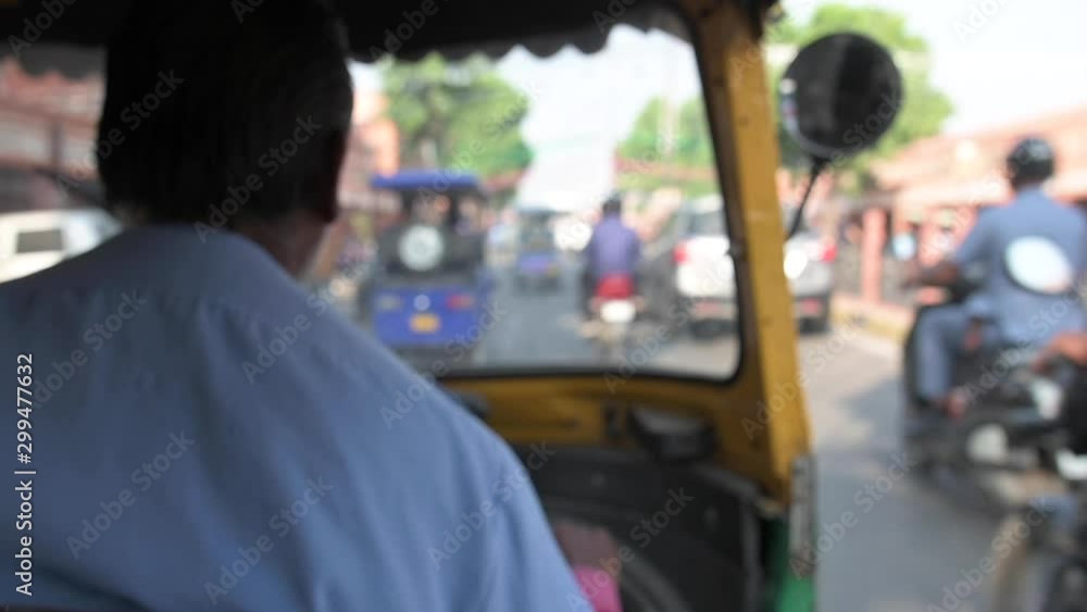(Slow motion video)Blurred video of an unidentified driver who is riding his auto rickshaw (also known as Tuc Tuc) through the busy streets of the pink city of Jaipur, Rajasthan, India. (Slow motion video)Blurred video of an unidentified driver who is riding his auto rickshaw (also known as Tuc Tuc) through the busy streets of the pink city of Jaipur, Rajasthan, India.