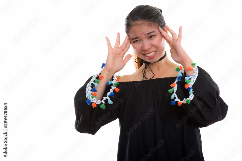 Studio shot of young Asian woman against white background Studio shot of young Asian woman against white background