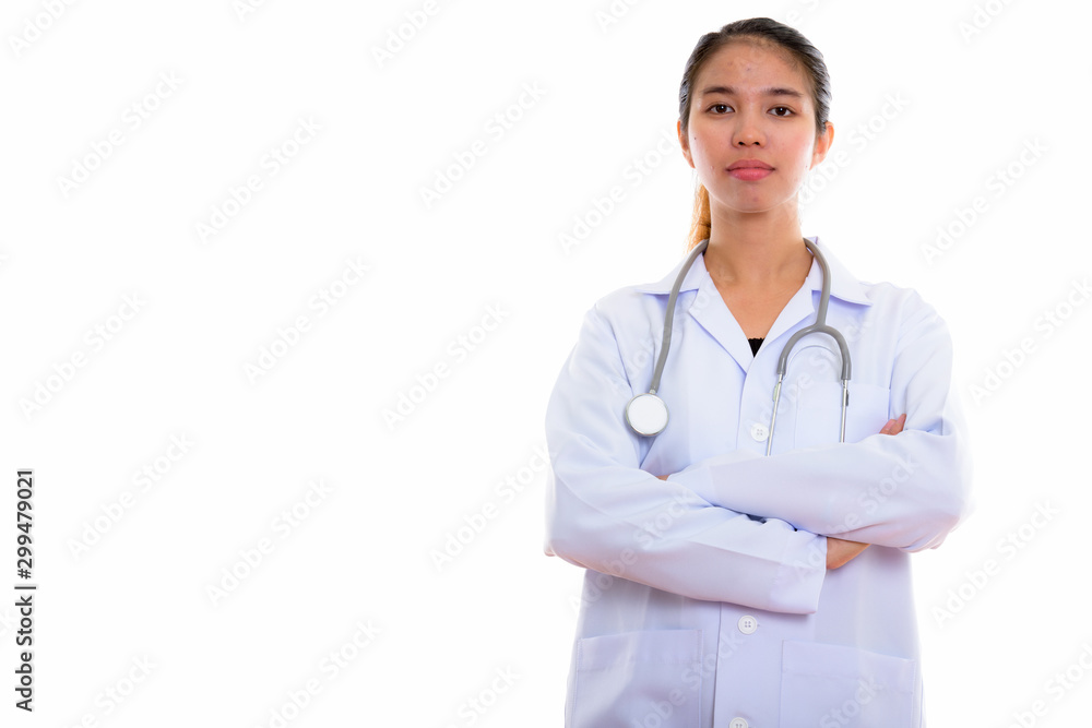 Portrait of young Asian woman doctor against white background Portrait of young Asian woman doctor against white background