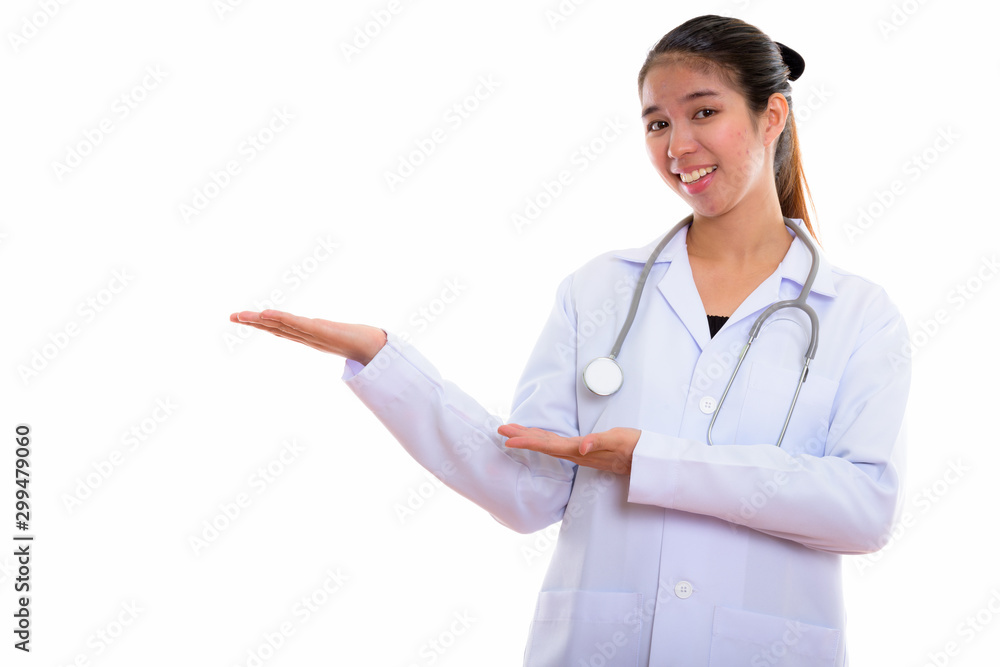 Portrait of young Asian woman doctor against white background Portrait of young Asian woman doctor against white background