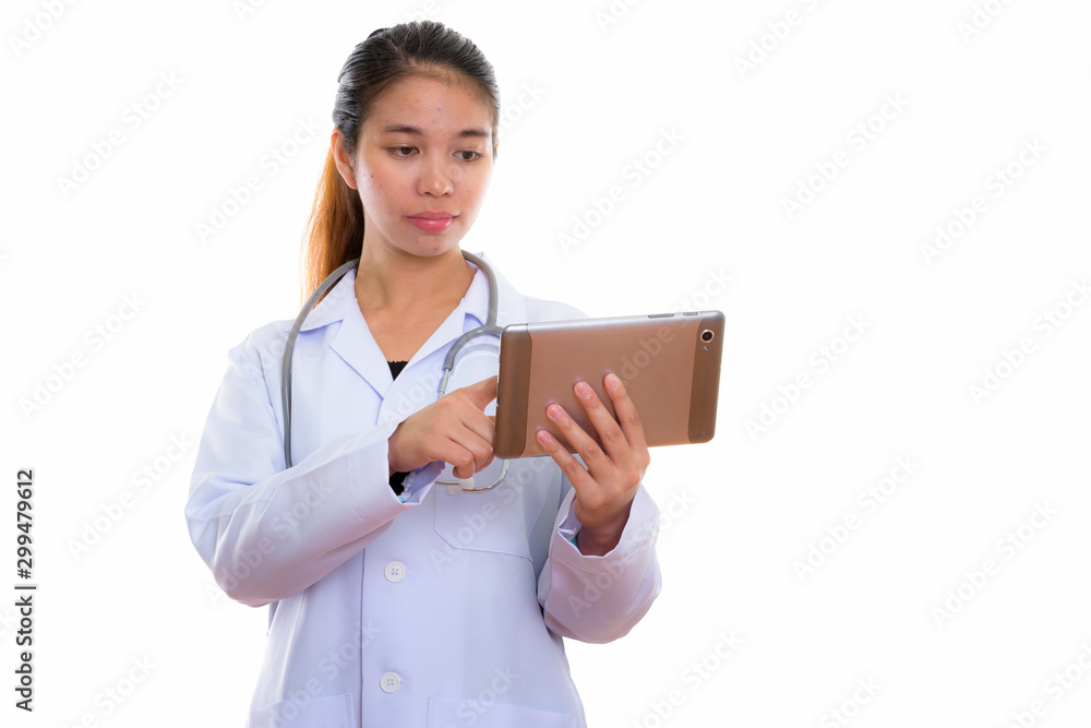 Portrait of young Asian woman doctor using digital tablet Portrait of young Asian woman doctor using digital tablet