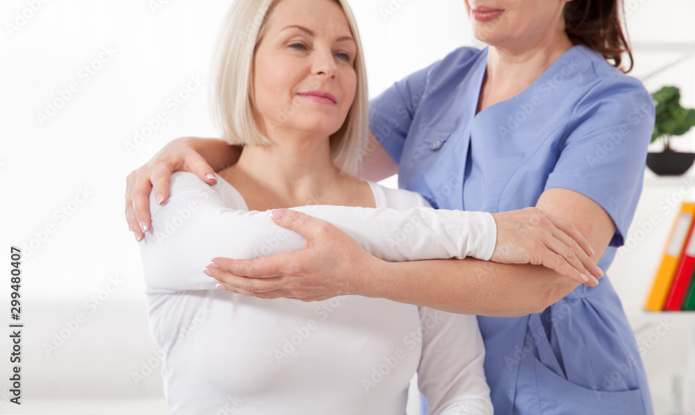 Fototapeta premium Physiotherapy, sport injury rehabilitation treatment. Woman having chiropractic back adjustment. Osteopathy, Alternative medicine, pain relief concept.