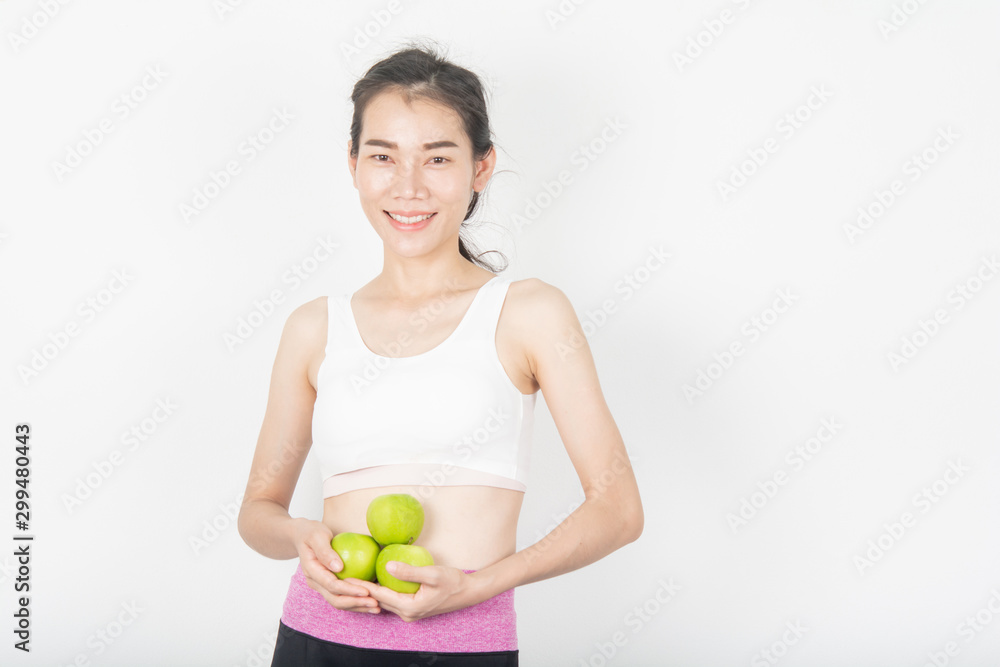 Healthy women With green apples in the white scene Healthy women With green apples in the white scene