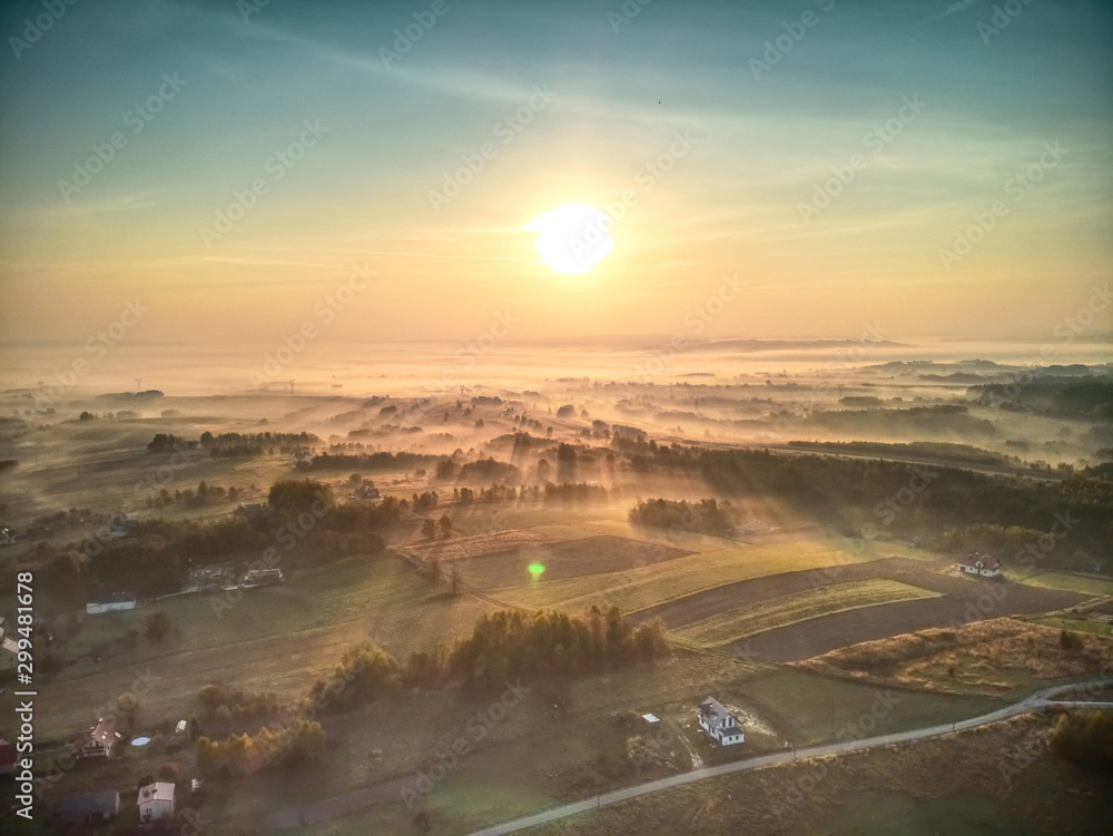 Early Morning Fog Sweeps Across Majestic Landscape