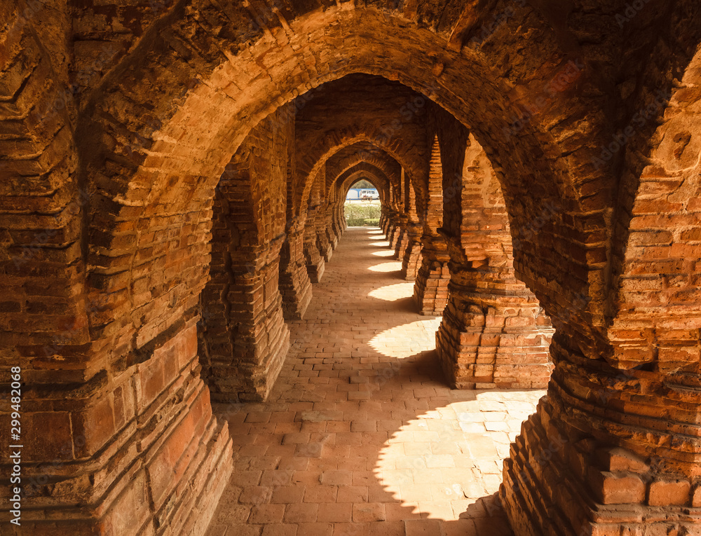 The arched corridors inside the ancient temple of Rasmancha built by the Malla Kings in Bishnupur in West Bengal in the 17th century.