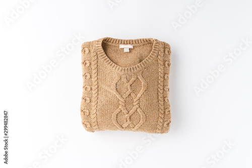 Konstfotografi Beige folded sweater isolated on white background