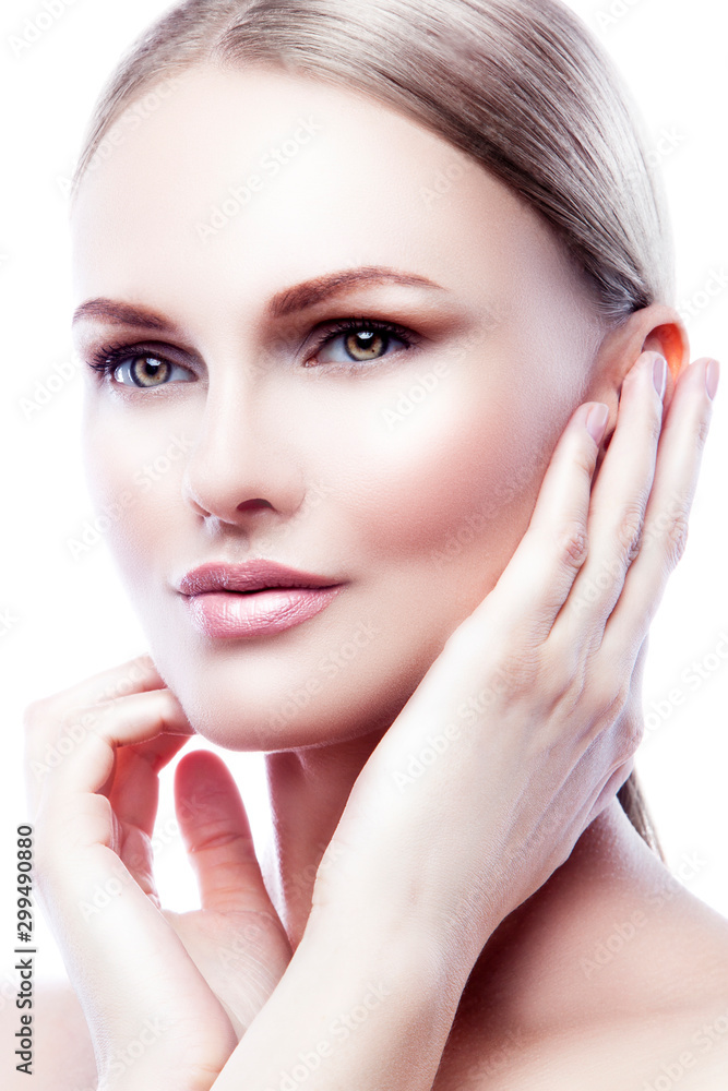 Beautiful cute young fashion model woman apply beauty treatment with hands, healthy perfect skin, nude natural make-up touching face with hands. Isolated. White background. Copy space Beautiful cute young fashion model woman apply beauty treatment with hands, healthy perfect skin, nude natural make-up touching face with hands. Isolated. White background. Copy space