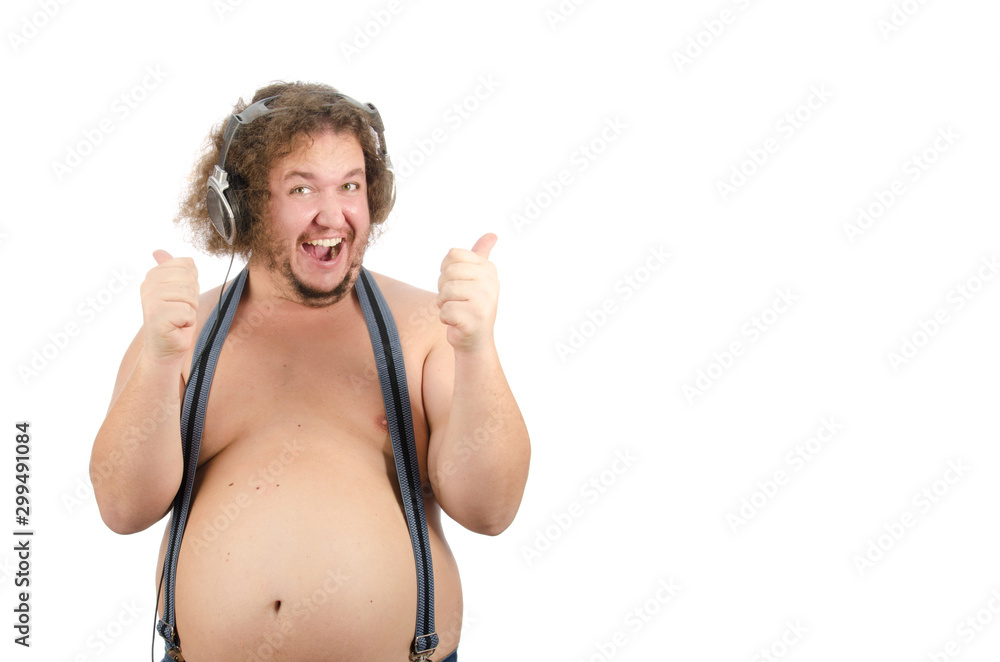 Funny fat guy listens to music on headphones. Stock Photo | Adobe Stock Funny fat guy listens to music on headphones. Stock Photo | Adobe Stock