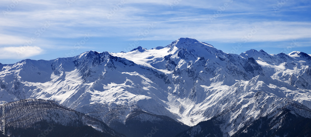 Sunlight snowy mountains and cloudy sky