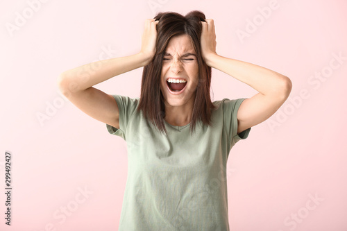 Stressed young woman on col...