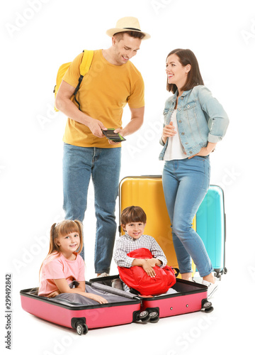 Happy family with suitcases...
