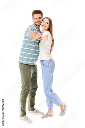 Portrait of dancing young couple on white background