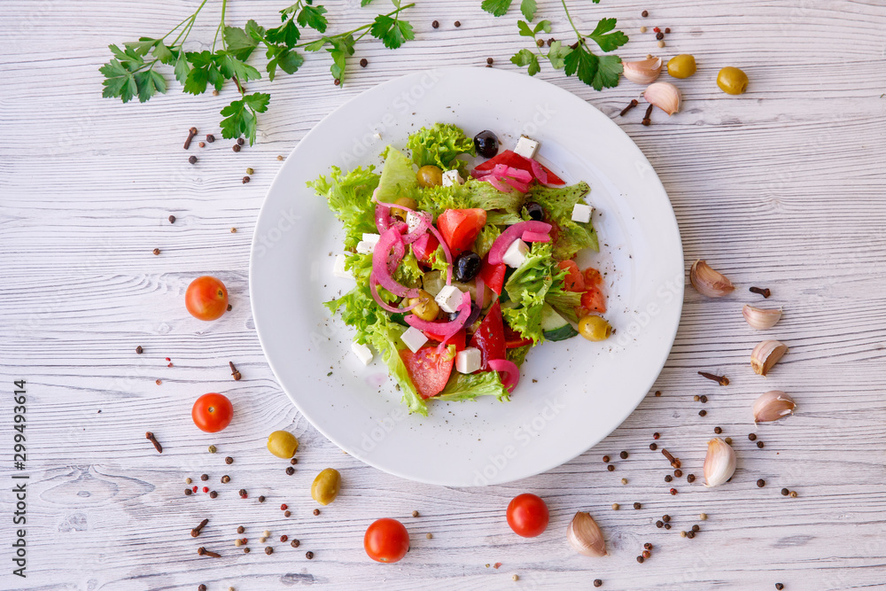 Tasty fresh Greek salad on white wooden table, Tasty fresh Greek salad on white wooden table,