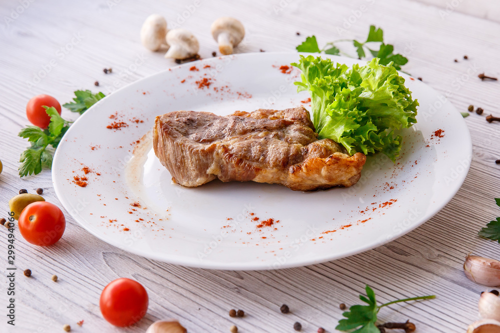 steak on a white plate