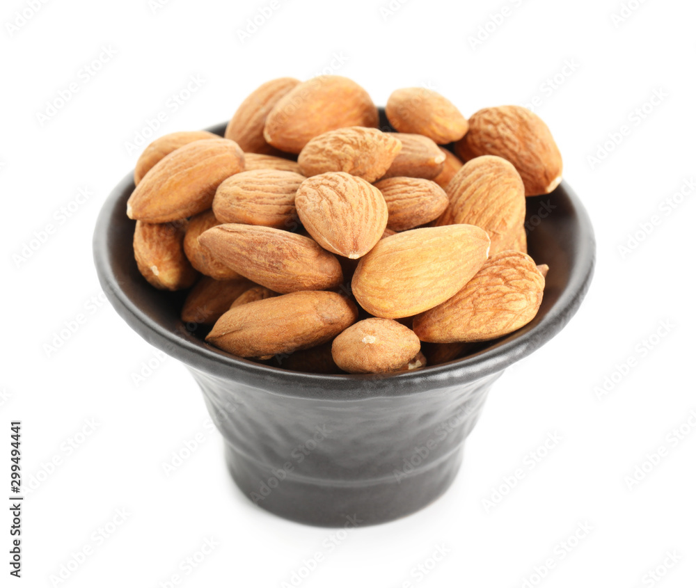 Bowl with tasty almonds on white background Bowl with tasty almonds on white background
