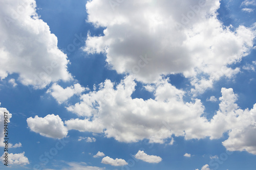 Transparent blue sky with clouds and atmospheric afternoon.