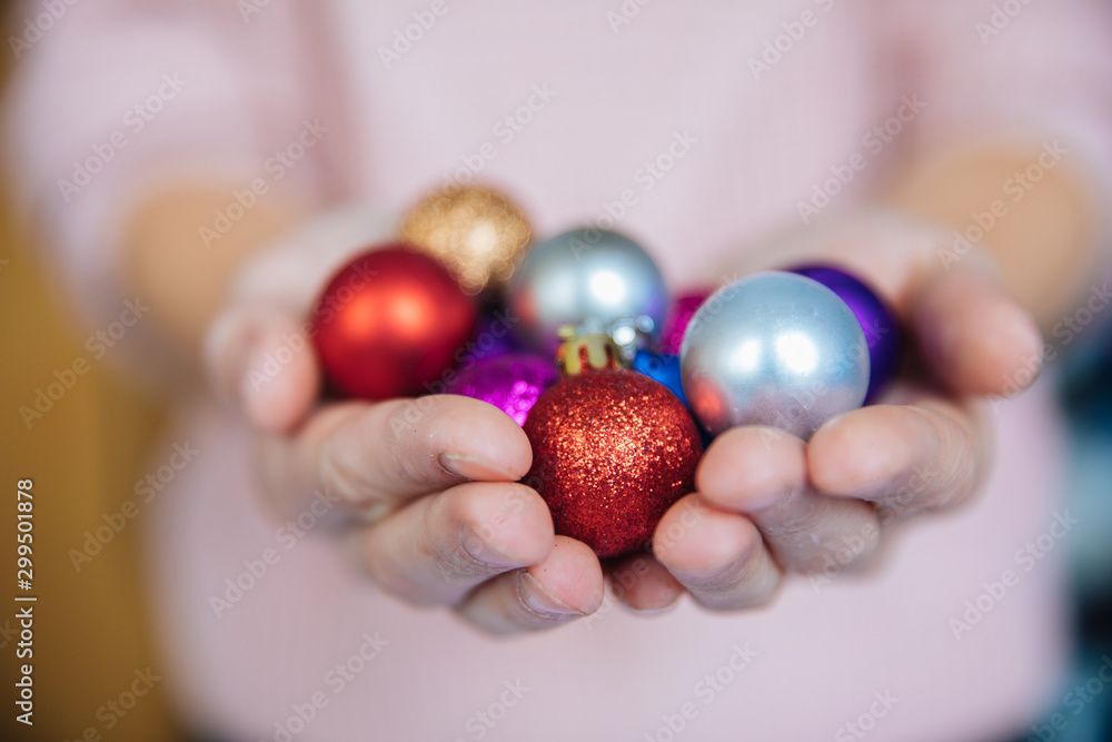 Awesome Christmas background, pink Christmas background with toys, Christmas tree balls in the palms of the palms, decorations for the highest events for the New Year and Christmas, a cozy home atmosp