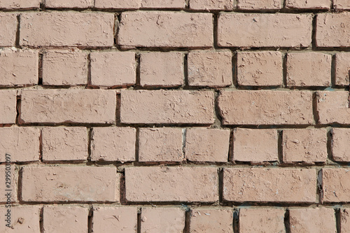 Texture of an old brick wall painted in pink