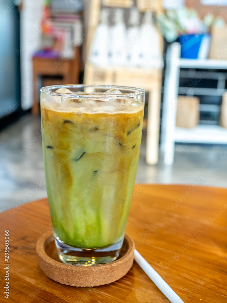 Mixed iced green tea and coffee beverage in glass in coffee shop Mixed iced green tea and coffee beverage in glass in coffee shop