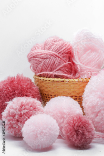 pink pompom balls and yarns 