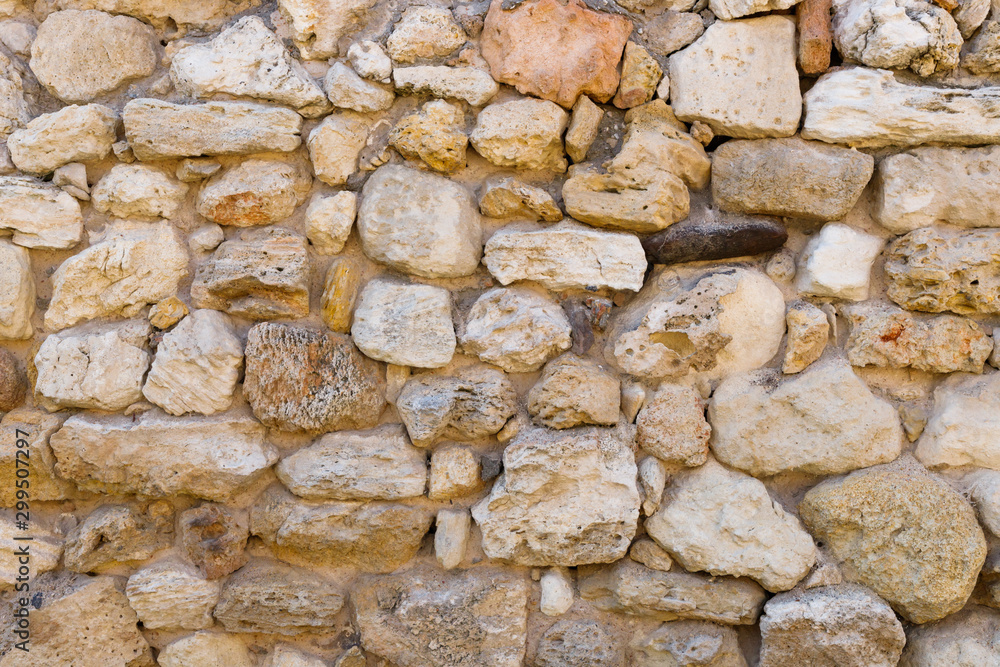 Texture of a antique stone wall. Old castle stone wall texture background. Stone wall as a background or texture. Texture of a antique stone wall. Old castle stone wall texture background. Stone wall as a background or texture.