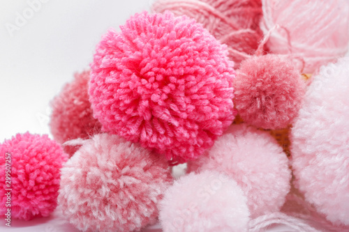 pink pompom balls and yarns 