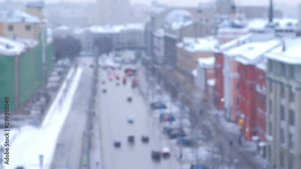 View on the center of city and the road from a height, blur. Winter time in beautiful European city covered with snow. Urban background. Moscow Russia in winter. View on the center of city and the road from a height, blur. Winter time in beautiful European city covered with snow. Urban background. Moscow Russia in winter.