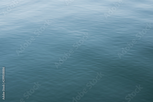Abstract background of blue water, sea. Blurred background. Rippled water texture. Abstract background of the sea surface.