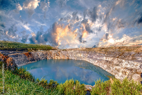 Photos Fantastic view of Open Pit Mining on cloudy sky