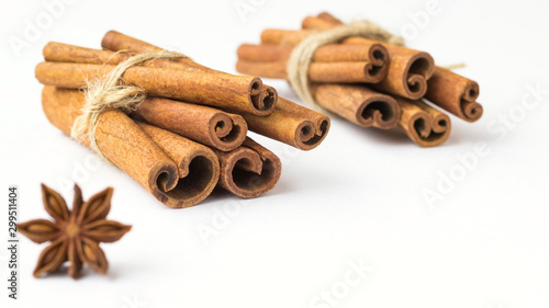 Spices: star anise and cinnamon sticks on white background. Close up.