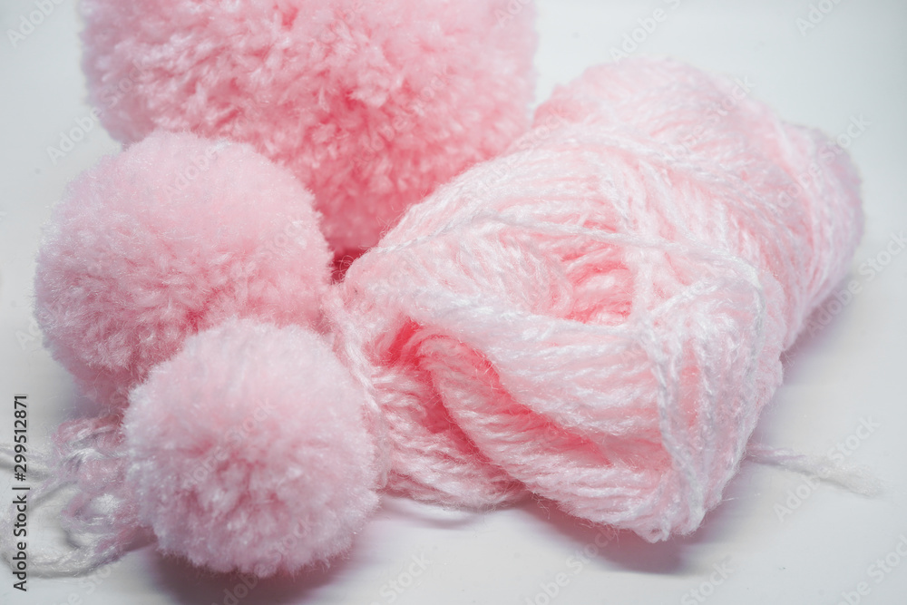 pink yarns and pompoms closeup pink yarns and pompoms closeup