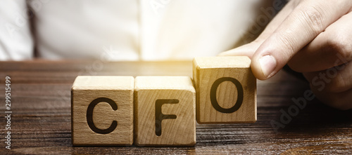 Obraz na plátne A man makes the word acronym abbreviation CFO