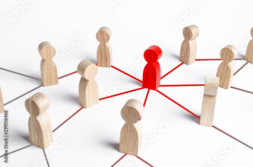 Fotografie The red figure of a person spreads his influence to people through a communication network