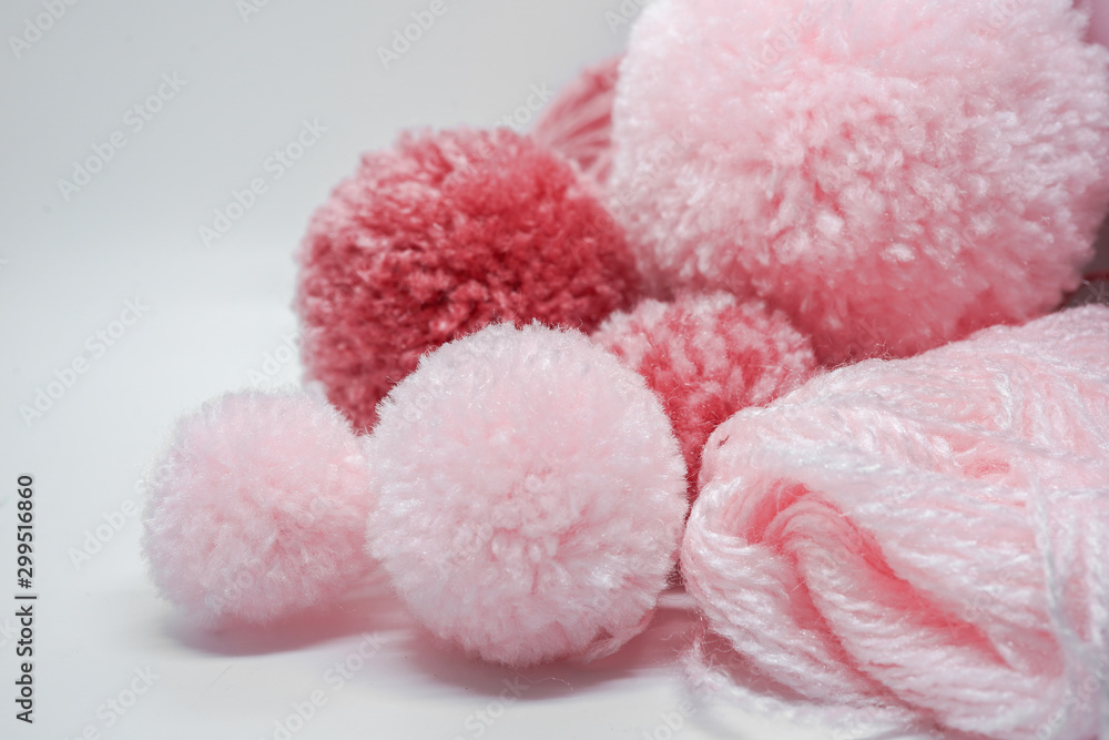 pink yarns and pompoms closeup pink yarns and pompoms closeup