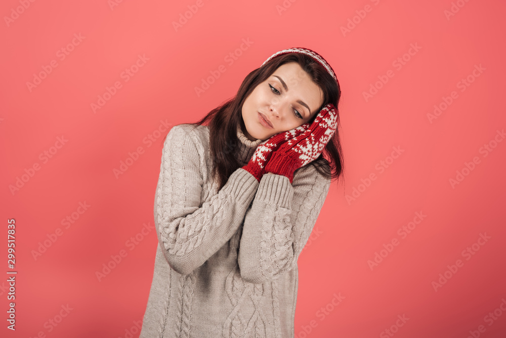 sad woman in red gloves standing on pink sad woman in red gloves standing on pink