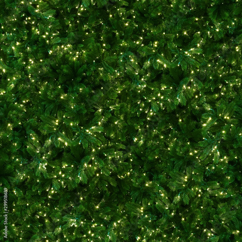 Seamless texture of Christmas tree decorated with LED light garland. New York. USA.
