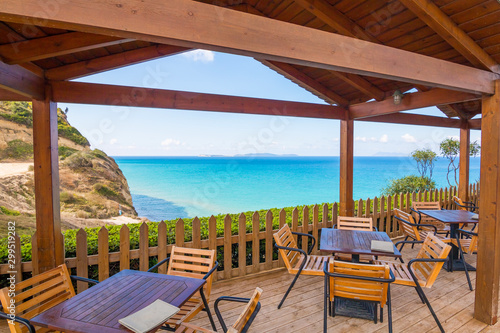 Beautiful tropical restaurant and beach with turquoise water. Corfu island  Greece.