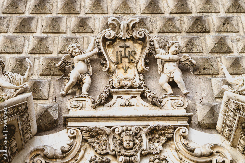 Decorative element of the facade of a church in Naples Italy