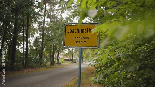 Slow motion lateral shot revealing Joachimsthal town traffic sign photo