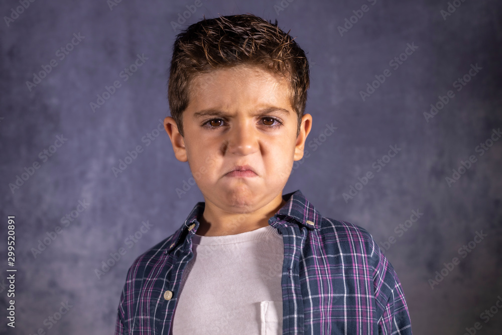 Angry child. Little boy with an angry expression. Stock Photo | Adobe Stock