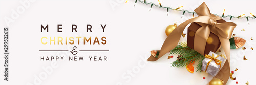 Merry Christmas and Happy New Year. Background with realistic festive gifts box. Xmas present. brown boxes with beige ribbon gift surprise, Golden Christmas baubles, balls, glitter gold confetti.