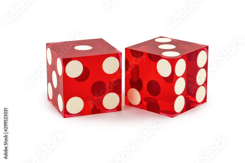 Two red professional game dice closeup isolated on a white background /one and three with a light shadow