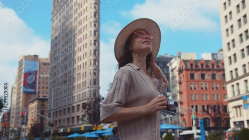 Young girl with retro camera at Flatiron in New York
