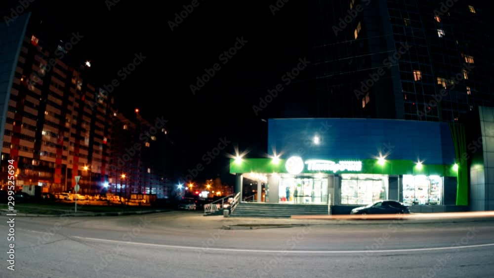 car traffic and supermarket at night, timelapse