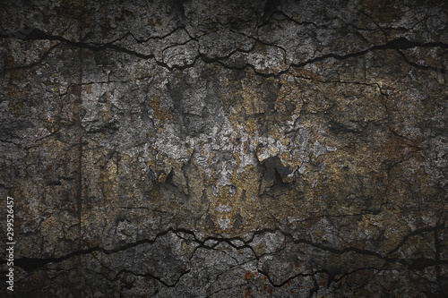 abstract creative texture using multi-exposure technique. Dark background with stone surface and cracks
