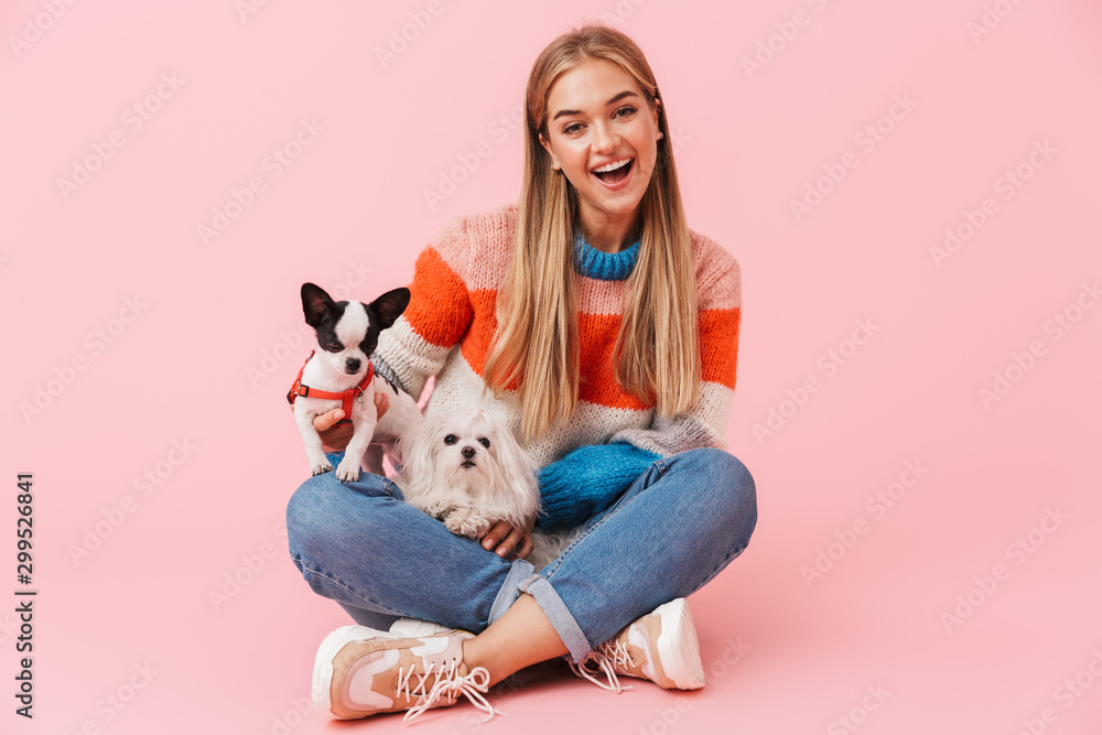 Cute lovely girl wearing sweater sitting with legs crossed Cute lovely girl wearing sweater sitting with legs crossed