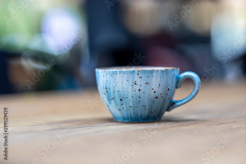 blue coffee mug on the wooden table