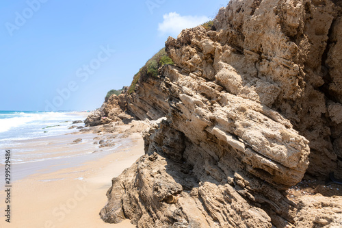 Sea beach With stone ledges and foamy waves on the shore of Ashkelon National Park